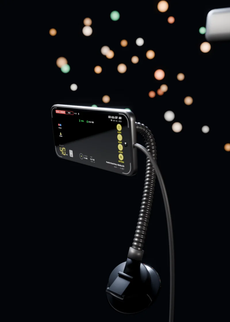 An original 3D render of a phone held sideways on a magnetic mount at night: a suction cup low on the windshield, a ribbed arm that bends up to a square magnetic head, a charging cable, and city lights beyond the glass.