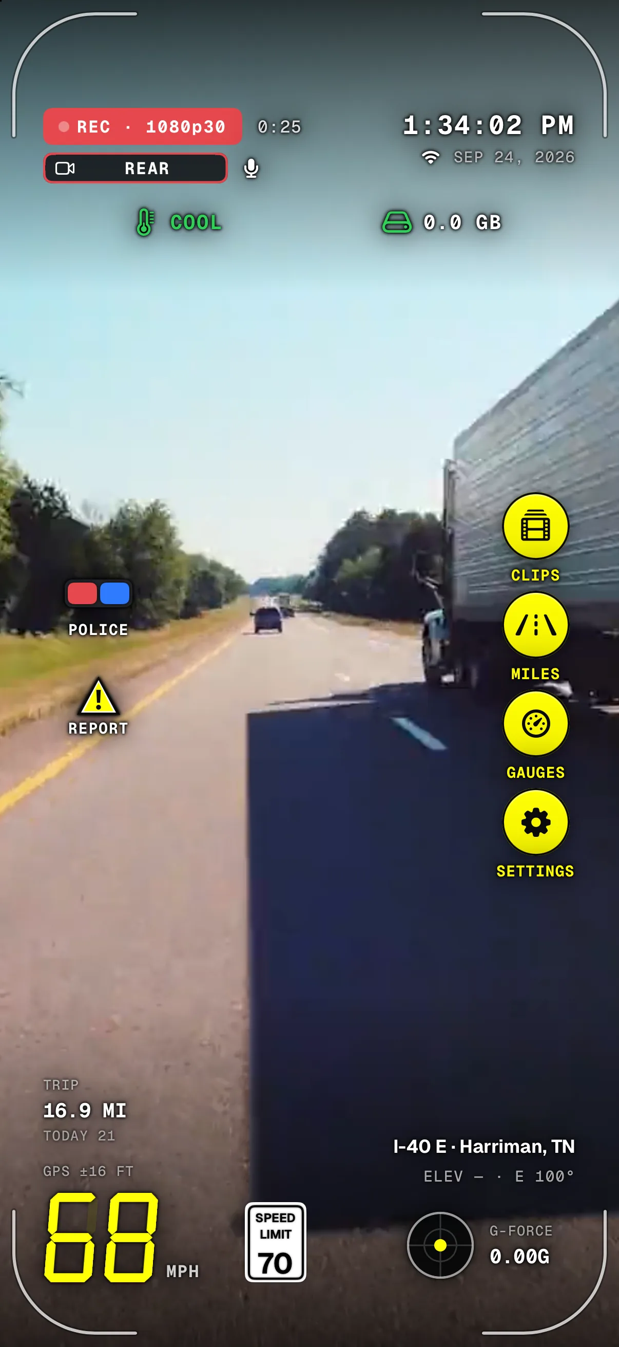 Dashivo recording a sunny highway drive: the dash cam HUD shows REC 1080p30, 68 mph under a 70 mph speed-limit sign on I-40 E near Harriman, Tennessee, at 1:34 PM, with a strong black shadow keeping the readouts legible over the bright sky.